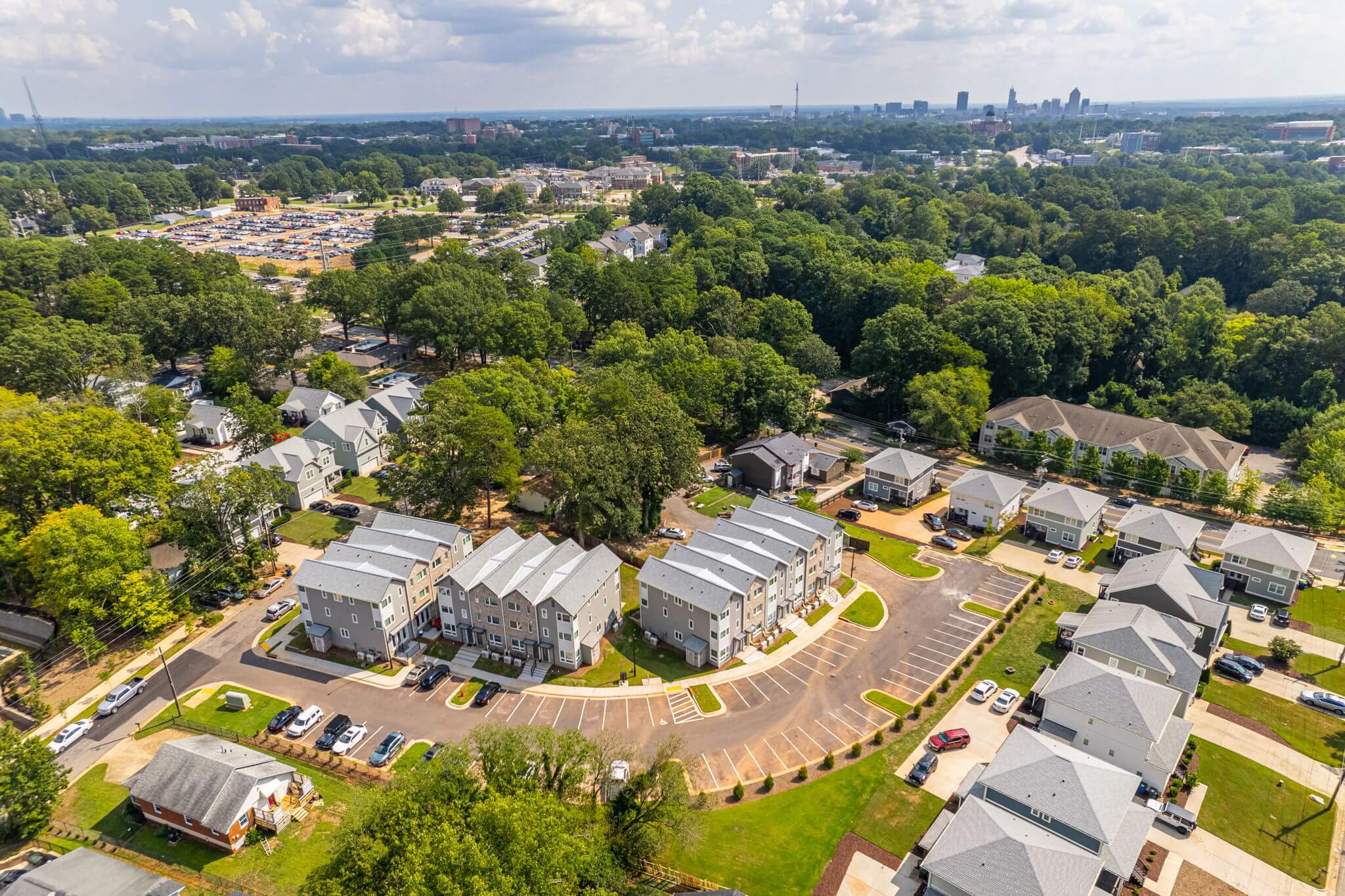 gorman row off campus townhomes and houses near nc state aerial view community ncsu campus raleigh skyline